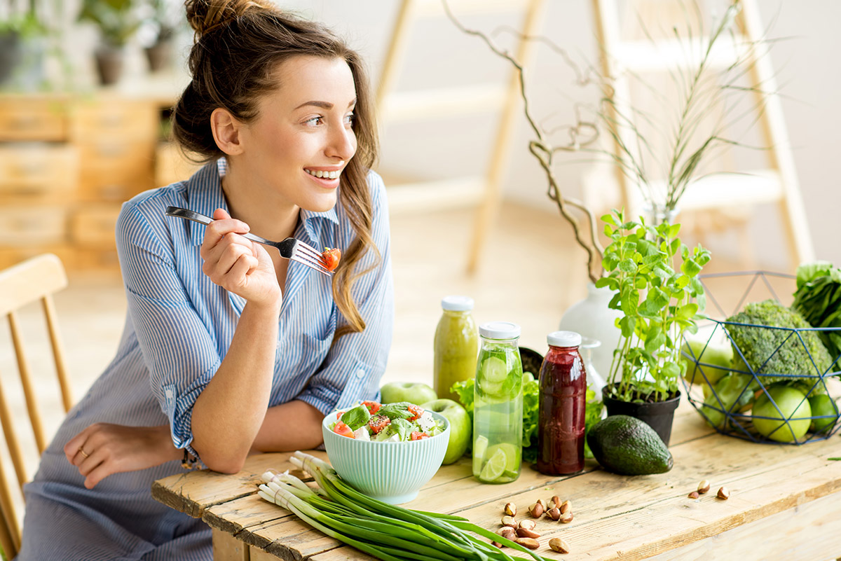 pregnant woman happy eating organic foods on an organic diet